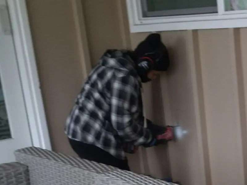 Professional electrician installing an exterior outlet in Santa Cruz